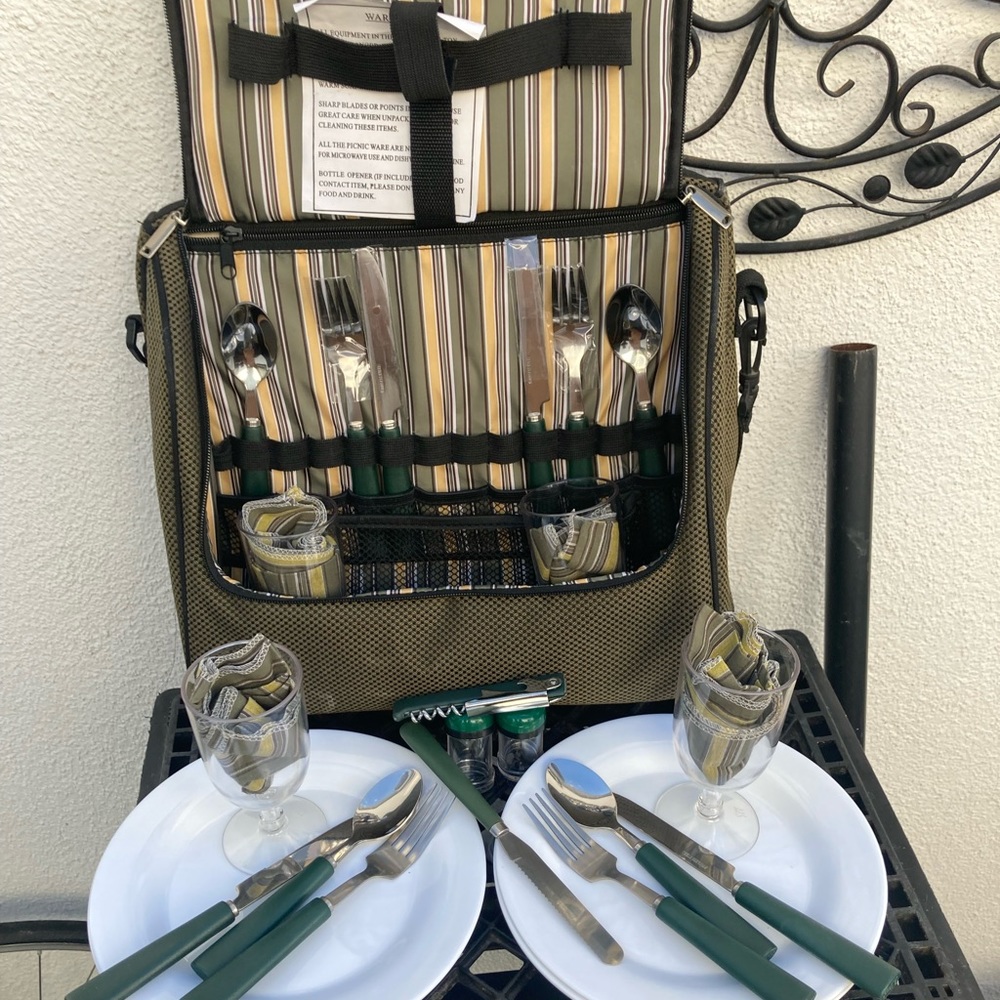 Picnic cooler wine and, charcuterie with the cutting board and utensils